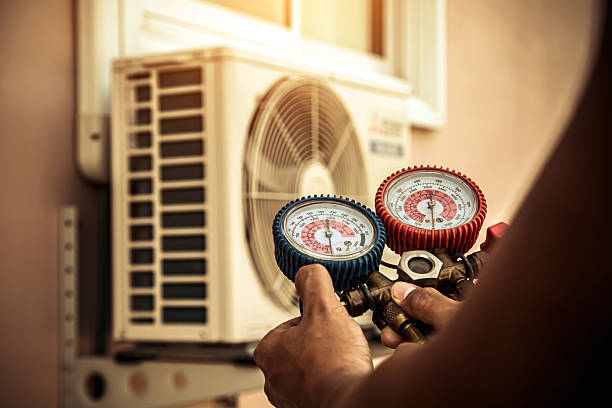 Professional Ac Installation technician working in Halls, TN